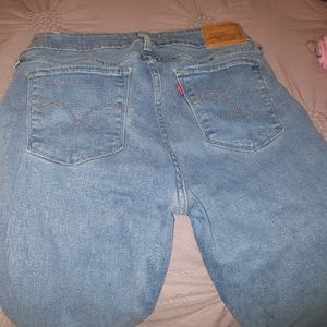 Levi's 711 Mid Rise Skinny Jeans Medium Wash Blue Denim size 26 stretchy